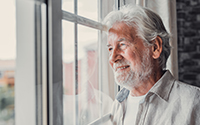 Happy,Thoughtful,Older,70s,Man,Looking,Out,Of,Window,Away