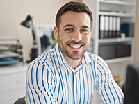Young hispanic man business worker using computer working at office