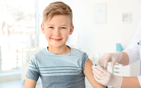 Doctor,Vaccinating,Little,Boy,In,Hospital